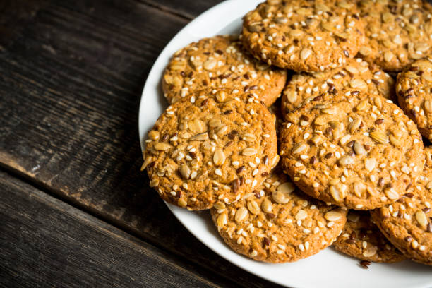 istock Fresh and healthy cookies with chocolate and seeds on the rustic background 1216146077