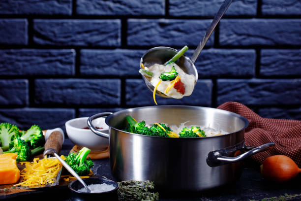 istock delicious cream soup with broccoli, green bean, fried bacon, and shredded cheddar cheese 1216148848
