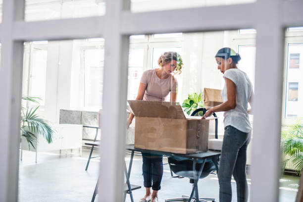 istock Young Businesswomen Moving Into New Office Space 1216149296