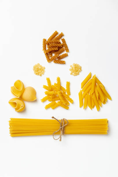 istock Raw italian spaghetti and pasta on a white background 1216154187