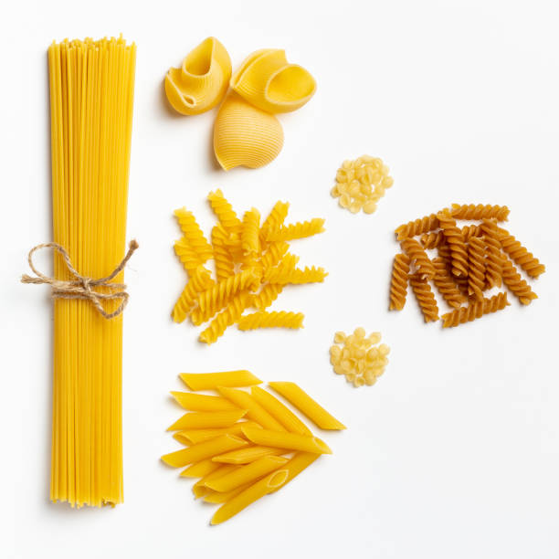 istock Raw italian spaghetti and pasta on a white background 1216154190