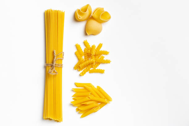 istock Raw italian spaghetti and pasta on a white background 1216154216