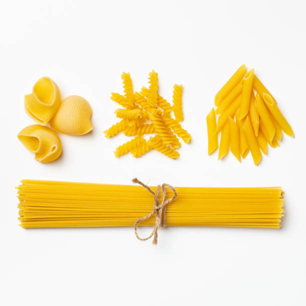 istock Raw italian spaghetti and pasta on a white background 1216154326