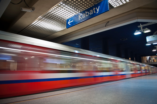 Modern metro underground  station with moving train, Warsaw in Poland.