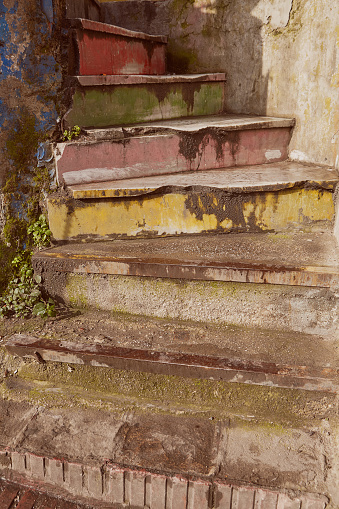 Concrete rainbow spiral staircase with faded shabby paint, Istanbul, Turkey.