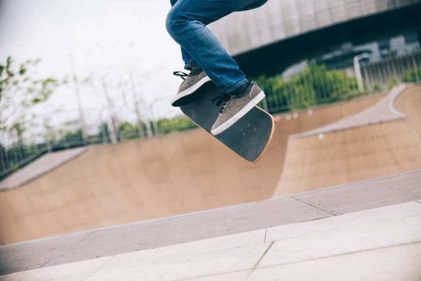 istock Skateboarder skateboarding at skatepark ramp 1216157296