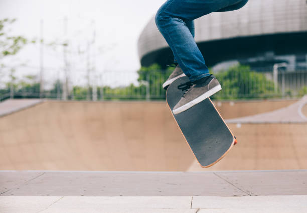 istock Skateboarder skateboarding at skatepark ramp 1216157339
