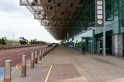 Singapore, Singapore - March 30 , 2020 : Outside Changi Airport terminal 3 middle of afternoon with almost no people