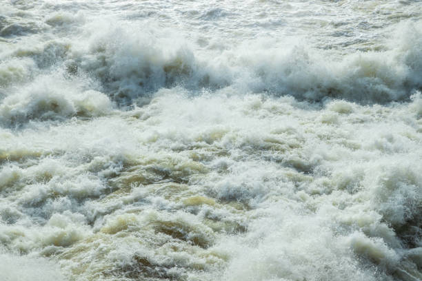 istock Splashing water waves on the spring fast river 1216164194