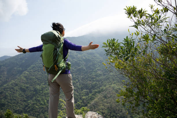 istock Successful hiker enjoy the view on mountain top 1216164391