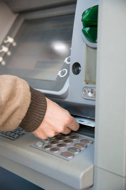 istock man who is withdrawing money at an ATM 1216166454