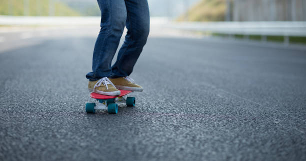 istock Skateboarder skateboarding on highway road 1216166862