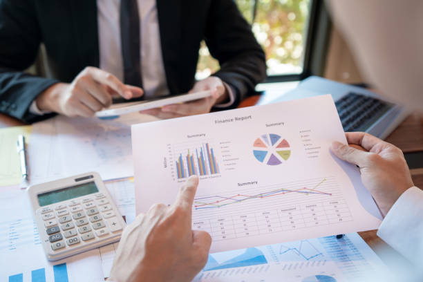 istock Business Corporate team brainstorming, Planning Strategy having a discussion Analysis investment researching with chart at office his desk documents and saving concept. 1216169199