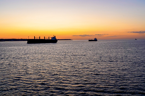 Cargo ships in sunset light in Oresund, Sweden