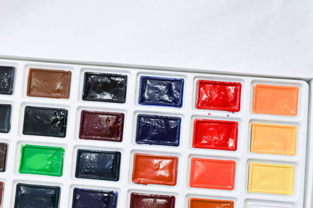 istock Multi-colored paints in squares. Watercolor paints. Close-up 1216169946