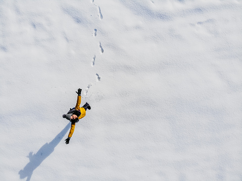 Aerial view woman standing in snow