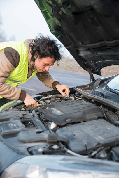 istock man with a problem with the car, with reflective vest 1216171374