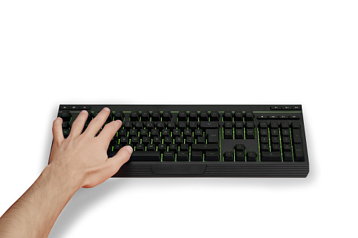 Male hand using computer keyboard on white background