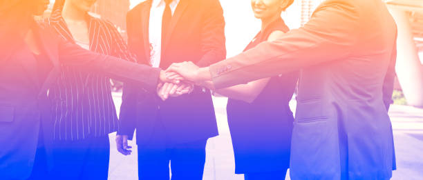 istock Banner  Group of young  people stack in Hands teamwork Together with a partnership team Joining Concept 1216175333