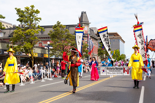 Victoria Canada May 22, 2019: The local Korean community and supporters in National dress at the Victoria Day Parade.  This is Victoria's largest parade and attracting well over 100,000 people from Canada and the USA.