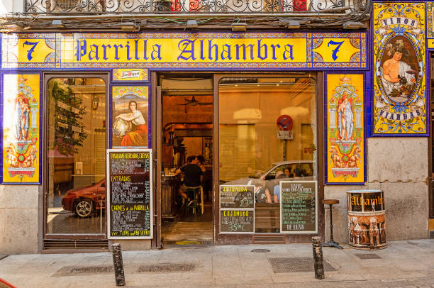 Madrid, Spain - 23 July 2018: Typical old spanish tavern with wooden tables and chairs in Madrid. Spain. Bodega - type of restaurant in Madrid