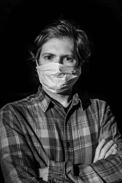 istock Quarantined man portrait with surgical mask 1216178277