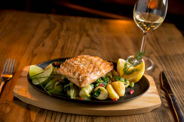 istock Salmon fillet with gratinated potatoes, leek and spinach 1216180667