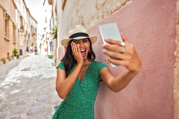 istock Young Brazilian woman taking a selfie 1216180704