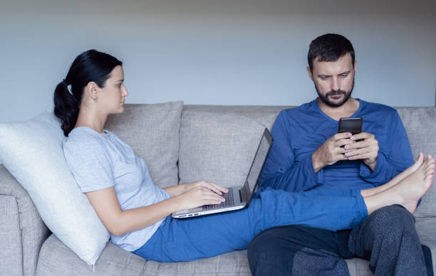 istock A young family works from home using computers. Couple working remotely online while on quarantine. Stay at home concept. Corona virus covid-19 pandemic outbreak. 1216180956
