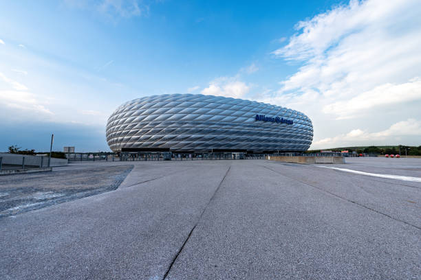 Allianz Arena - Football Stadium in Munich Germany Munich, Germany - September 7th, 2018: Allianz Arena (Fussball Arena Munchen, Schlauchboot), the home football stadium for FC Bayern Munich. Widely known for its exterior of inflated ETFE plastic panels, it is the first stadium in the world with a full colour changing exterior. From the year 2012 it became home to the museum of the team of the Bayern Munich, FC Bayern Erlebniswelt. allianz arena stock pictures, royalty-free photos & images