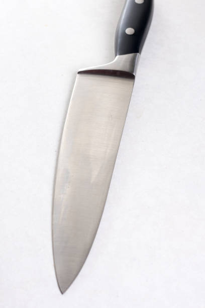 istock New chef knife isolated above white marble background table 1216182037