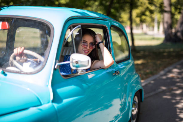 istock Female driver in blue vintage car 1216182258