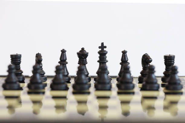 istock Black chess piece focus front pieces on the chess board game, chess game for play compettition hobby time 1216182336