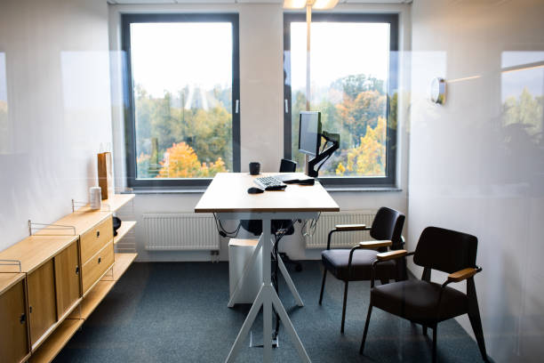 istock Modern interior of office. A stand up desk with desktop computer in modern workplace 1216182685