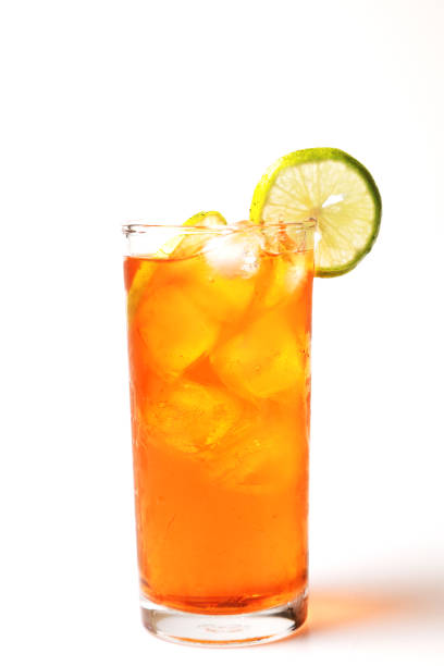 istock Iced tea lemon juice fresh drink on white bakcground, Isolate black tea and lime lemon in the glass cocktail drink. 1216182694