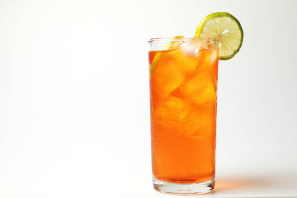 istock Iced tea lemon juice fresh drink on white bakcground, Isolate black tea and lime lemon in the glass cocktail drink. 1216182709
