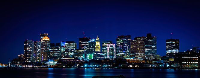 View of downtown Boston buildings and skyline over Mystic River in Massachusetts