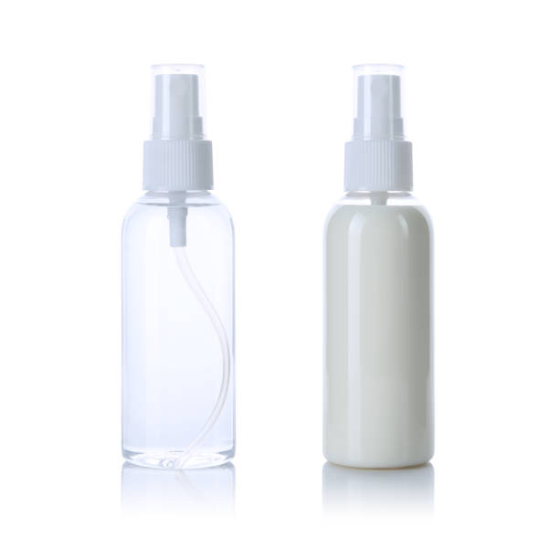 Transparent spray bottle with white cap filled with water & cream isolated on white background. Front and back view.
