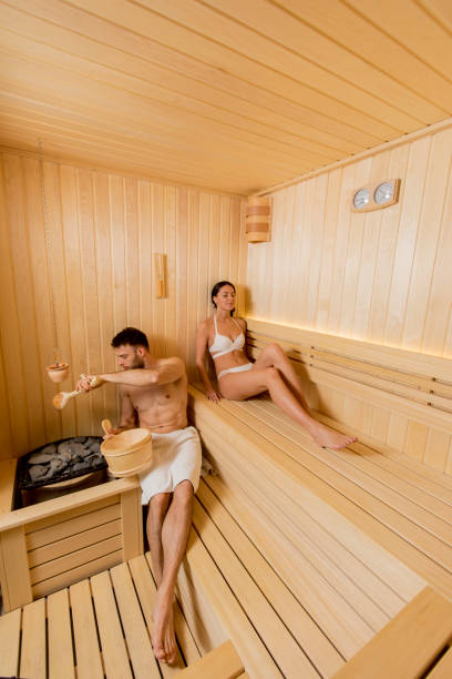 istock Young couple relaxing in the sauna 1216187053