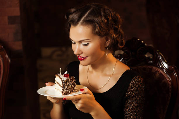 istock Pretty woman holding plate with dessert 1216187883