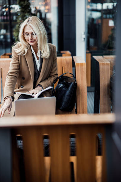 istock Modern elegant lady sitting in a cafe 1216188439