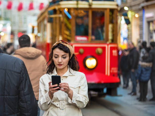 istock Portrait of beautiful woman while using cell phone 1216188652