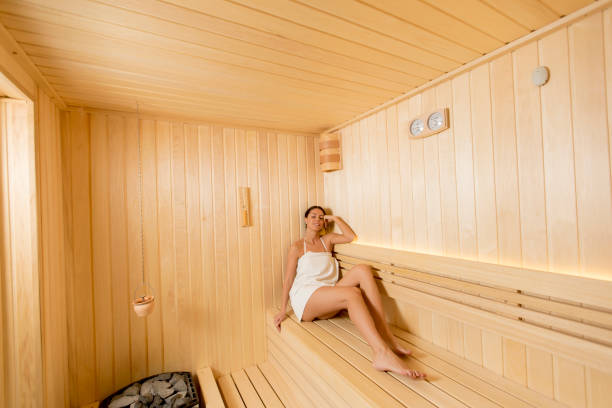 istock Young woman relaxing in the sauna 1216189969