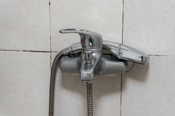 istock a steel faucet, wall, white 1216190518