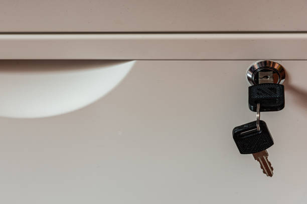 istock The key to the cabinet, lock, white, black 1216191269