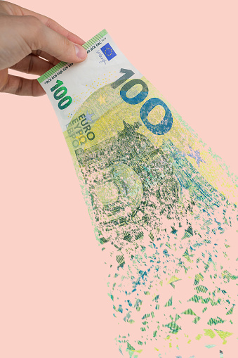 Picture Of An Euro Banknote Breaking Into Pieces