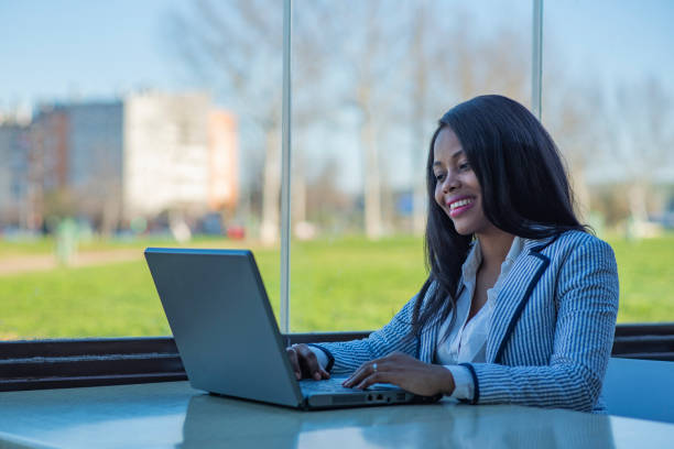 istock Beautiful smiling African-American woman using a laptop 1216192267