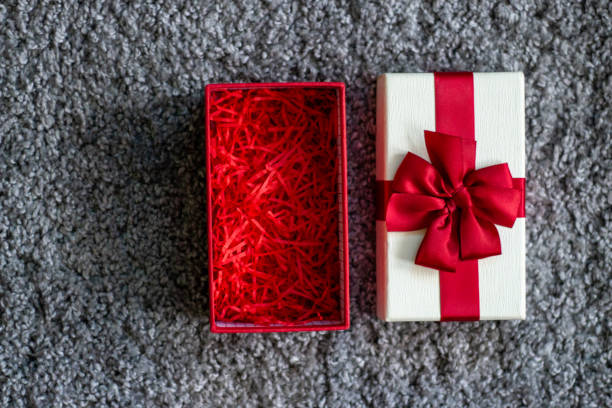 istock Box with ribbon and red bow 1216192280