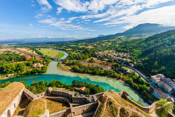 France - Sisteron, panorama View of the confluence of rivers Buëch and Durance from the Citadel of Sisteron, built 500 meters high on a rocky outcrop in the Provence-Alpes-Côte d'Azur region, in southeastern France. alpes de haute provence photos stock pictures, royalty-free photos & images