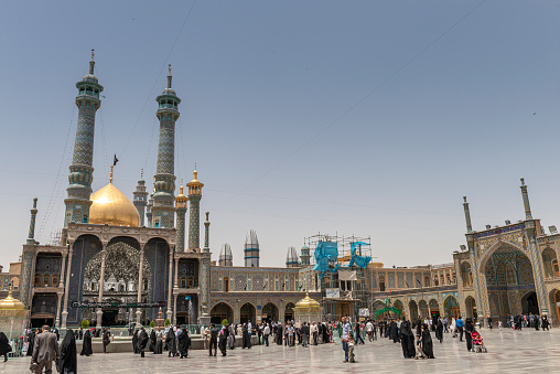 Qom- Iran. -may 14,2013: people and Mullahs with turban and long robe in the courtyard of the Fatima Masumeh shrine. Fatima Masumeh shrine is an important center of religion for sii sect.Qom- Iran. -may 14,2013: people and Mullahs with turban and long robe in the courtyard of the Fatima Masumeh shrine. Fatima Masumeh shrine is an important center of religion for sii sect.